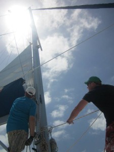 Caribbean Sailing Regattas raising the main sail